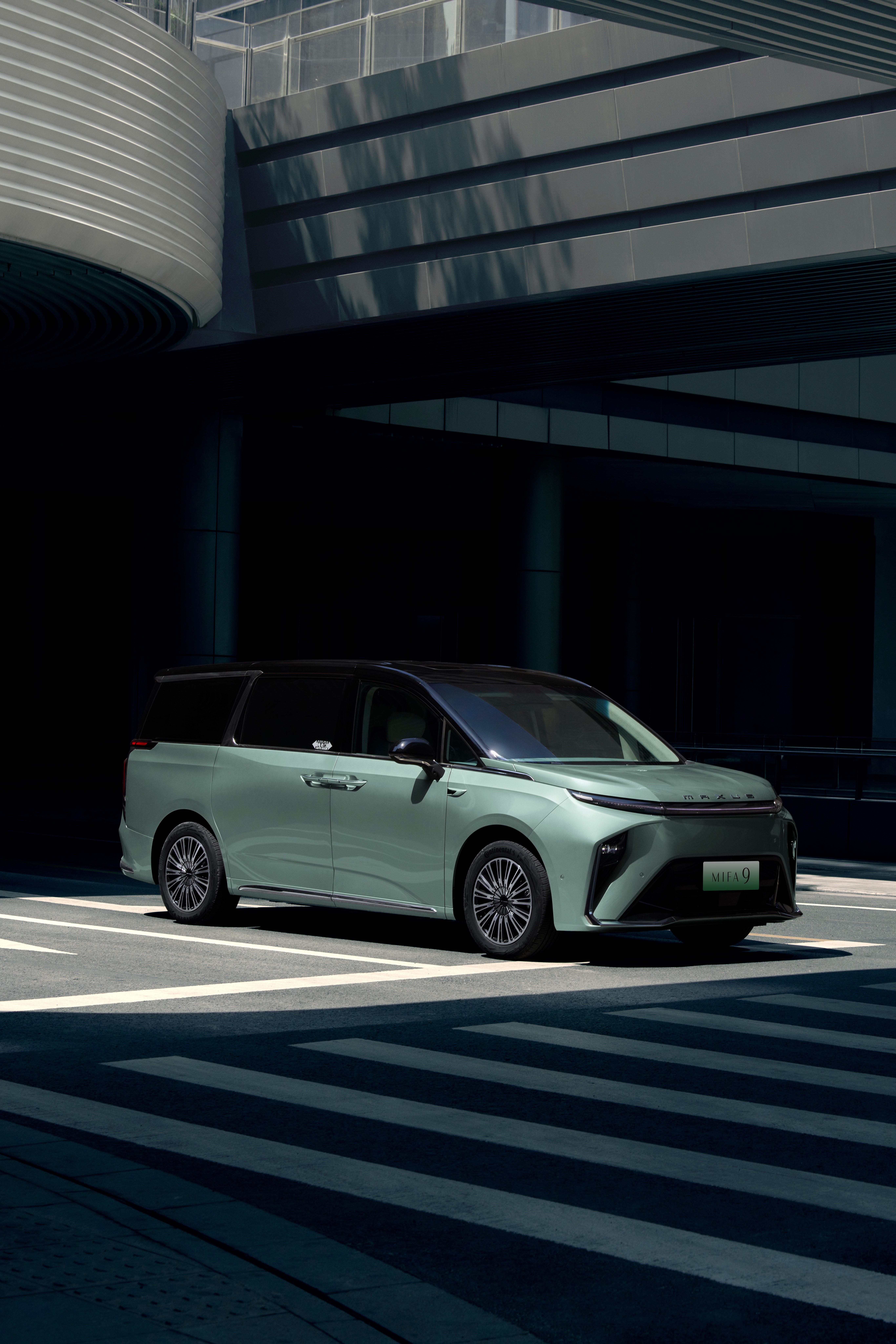 MIFA 9 front three-quarter green modern building