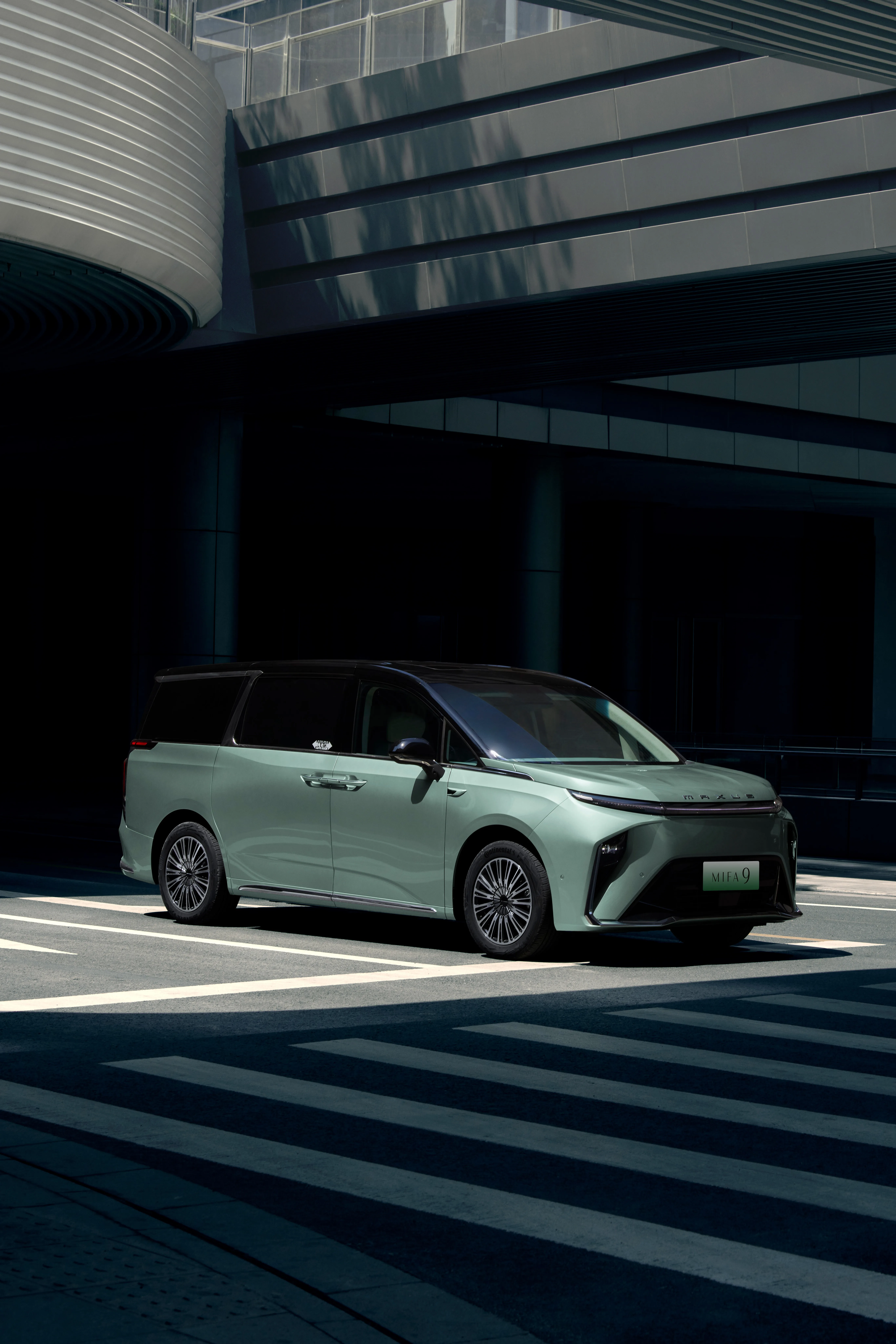 MIFA 9 front three-quarter green modern building